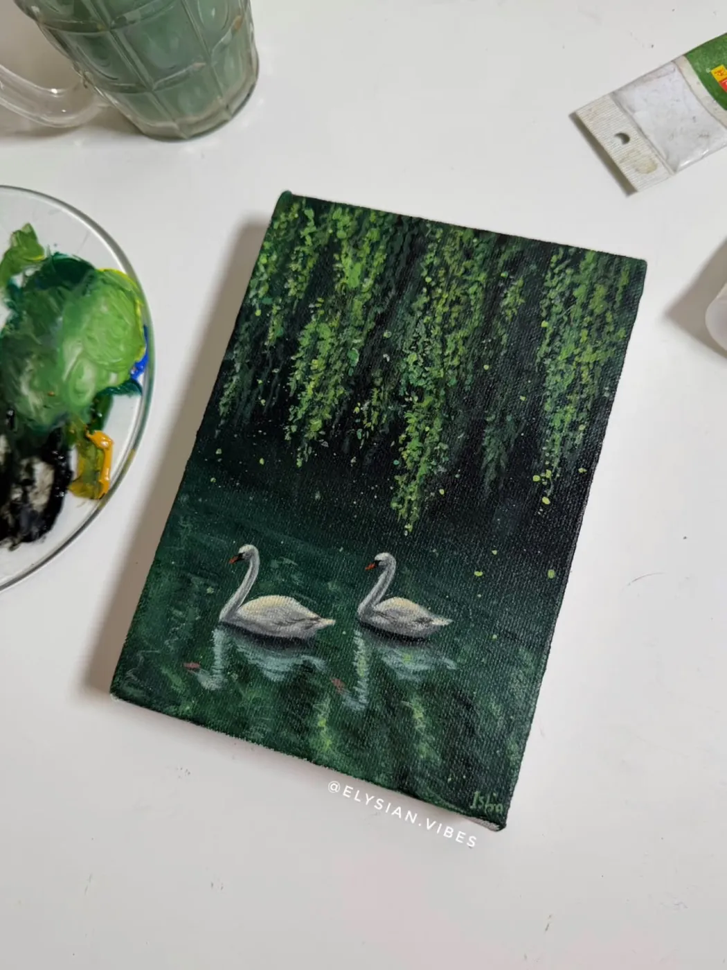 Swans in deep green